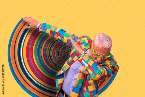 Obraz na plátně Old senior man performing dab dance moves
