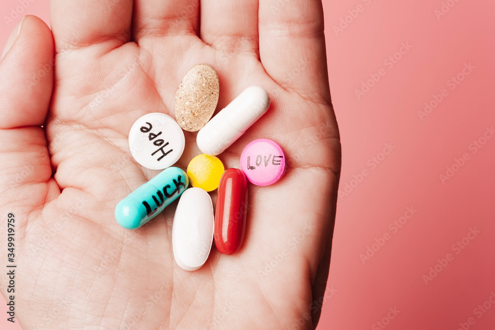 The concept of creative pills, a placebo in the hand, with joy, love, happiness, truth, power, dream The concept of creative pills, a placebo in the hand, with joy, love, happiness, truth, power, dream