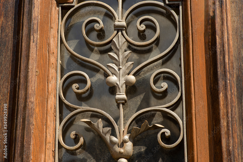 decorative elements of wrought iron grilles in the door decorative elements of wrought iron grilles in the door