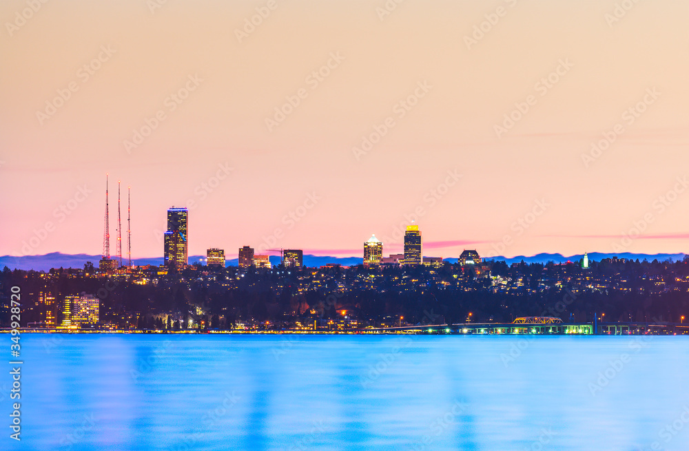  dock with background of Bellevue cityscape with reflection on lake washington at night