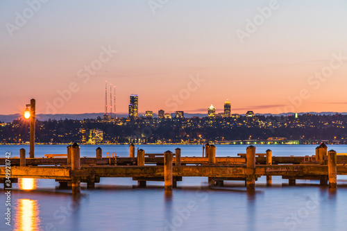  dock with background of Bellevue cityscape with reflection on lake washington at night photo
