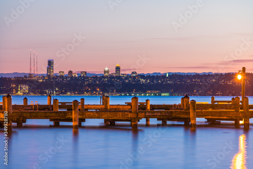  dock with background of Bellevue cityscape with reflection on lake washington at night photo