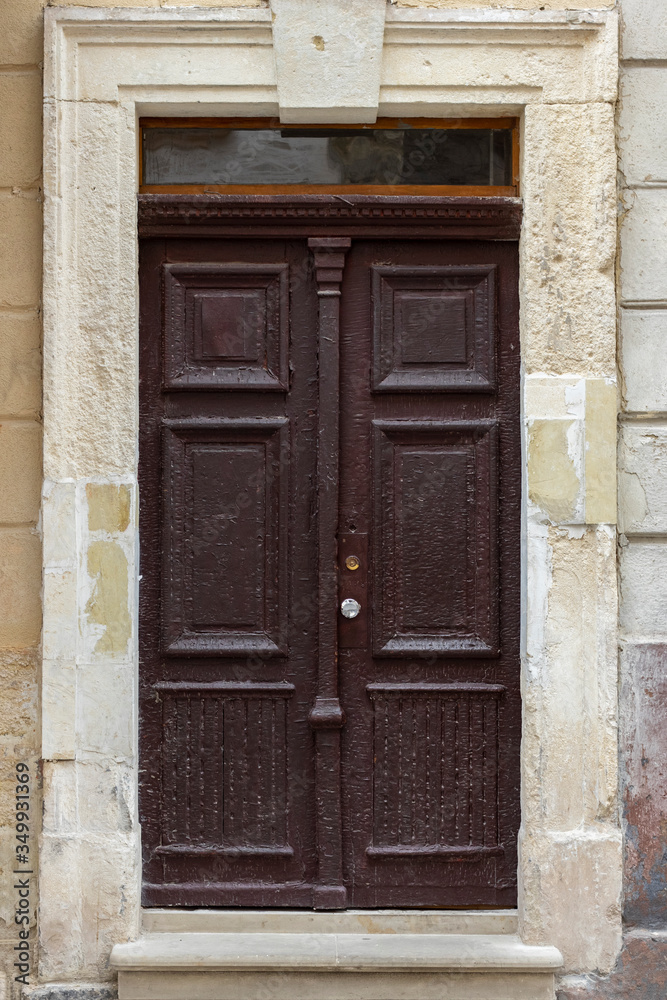 Vintage wooden door of antique house in an old city.