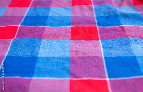 Checkered cloth texture. Squares on textile. Natural fabrics background.