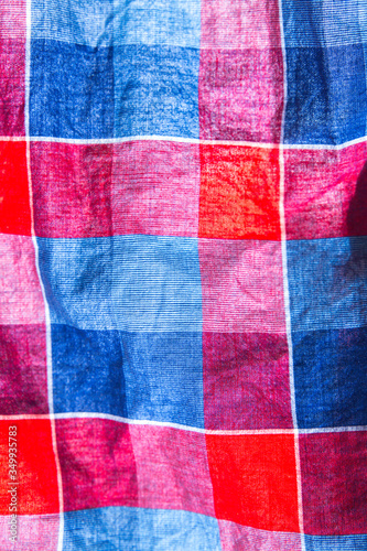 Checkered cloth texture. Squares on textile. Natural fabrics background.