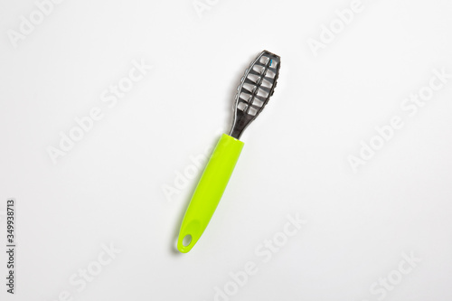Fish scaler - a tool to clean fish scale, isolated on white background.High-resolution photo.Blank label.