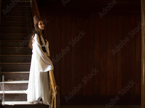 Portrait for a Sufi whirling woman dancer wearing white dress (Turkish/Semazen) performing art of Sama or physically active meditation of Sufism, and during spiritual dancing performance at Egypt