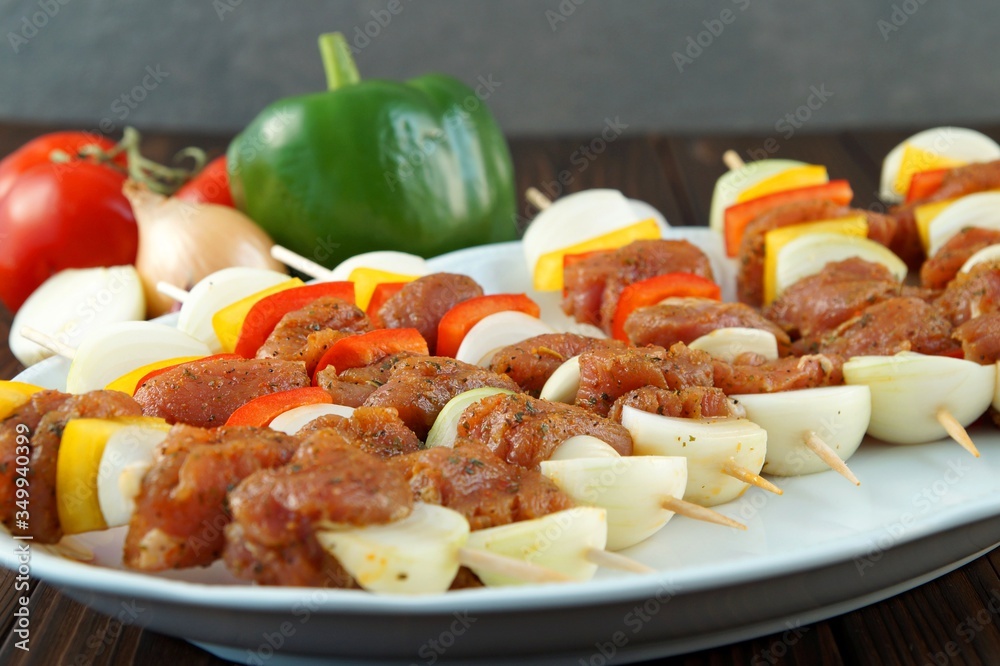 raw pork skewers, souvlaki made with pork fillet. shashlik with onion and paprika raw pork skewers, souvlaki made with pork fillet. shashlik with onion and paprika