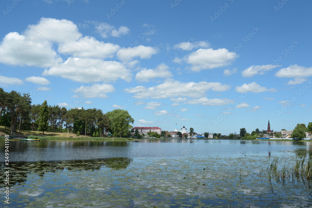 the bank of the river in which the water lilies bloom. On the far bank you can see a city with religious buildings.