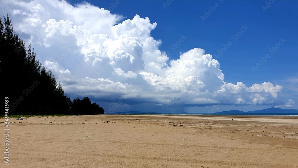 clouds over the beachBeautiful tropical beaches, white sand beaches and rain clouds are coming.  Highest pine way  Panoramic background concept Amazing beach landscape Vacation Luxury resort resort