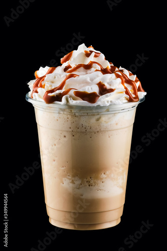 Caramel milkshake in take away cup isolated on black background