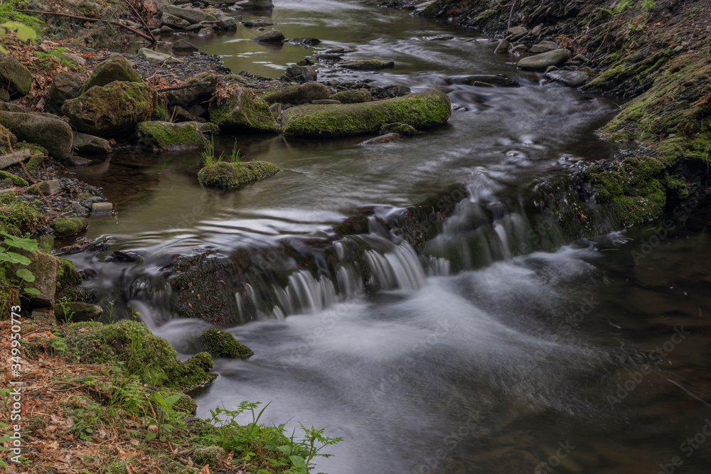 Lomna river in Trojanovice village in spring hot day Lomna river in Trojanovice village in spring hot day
