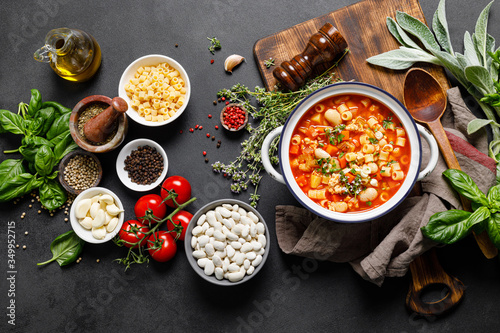 Cooking pasta e fagioli soup with chicken meat and vegetables, italian cuisine photo