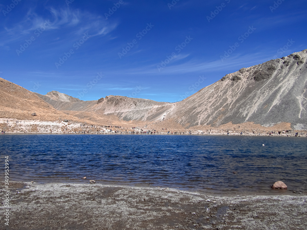 Panoramic view of the Laguna de la Luna, in the crater of the old Nevado de Toluca volcano, located at about 4600 meters above sea level. Lakes and mountain with blue sky.