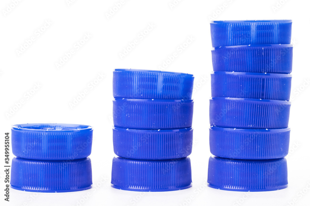 The growth chart is made up of blue plastic bottle caps. The growth chart is made up of blue plastic bottle caps.
