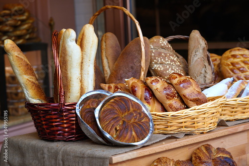 varieties of fresh bread sold in the oven. breads and buns made from various grains photo
