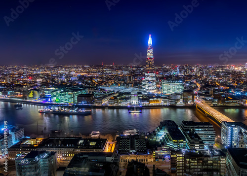 View of London City Skyline and the Thames River from the Rooftop at Night, UK