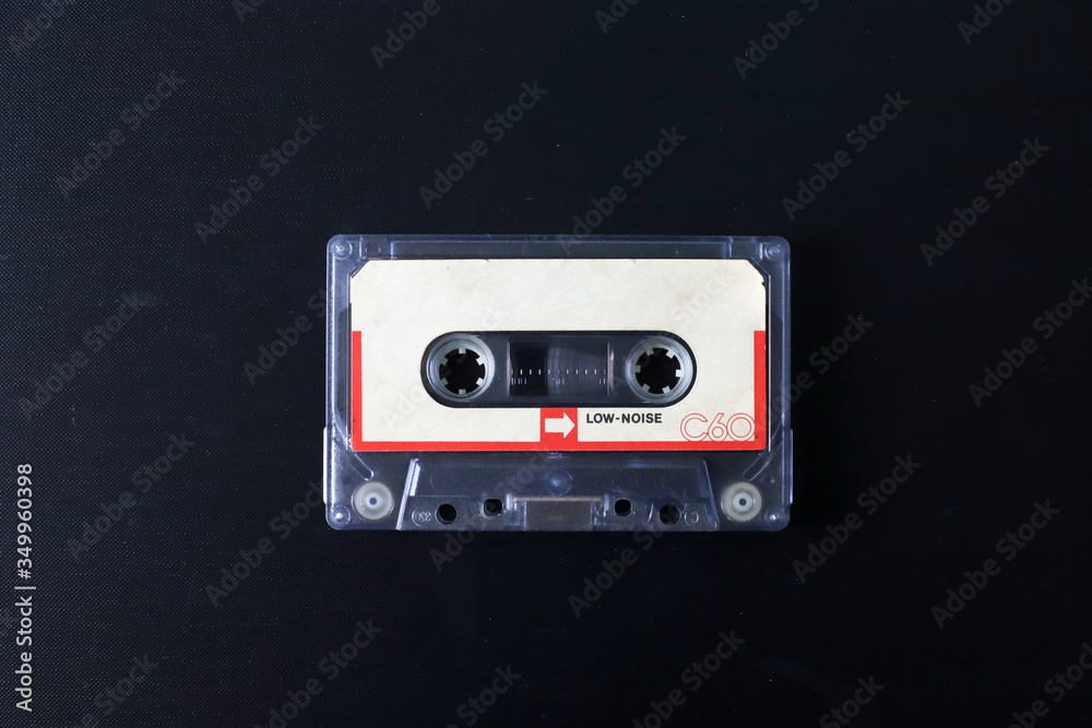 Fototapeta premium Old tape cassette, old or aged wood background. İsolated casette