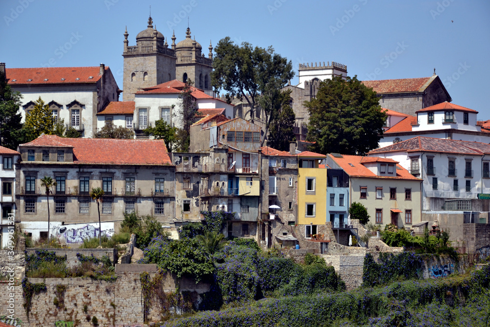Porto, Portugal - August 20, 2015: Cityscape of Porto, near the Douro river. You can see the two bell towers of the city's cathedral (Sé de Porto)