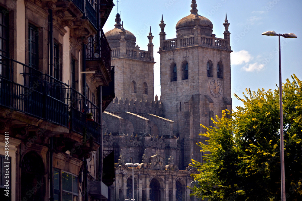 Porto, Portugal - August 17, 2015: The Porto Cathedral seen from a street. It is a 12th century fortress church located in the historic center of the old town of Porto.