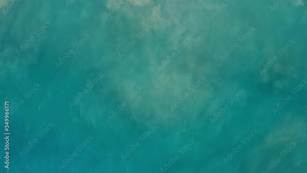 Aerial drone view flying over calm azure waves and sand beach, no people. Above shot of ocean shore and waves of beautiful sea, ocean water with waves on the beach during sunny day Aerial drone view flying over calm azure waves and sand beach, no people. Above shot of ocean shore and waves of beautiful sea, ocean water with waves on the beach during sunny day