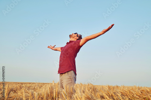 Man enjoying in wheat field. Summer concept.