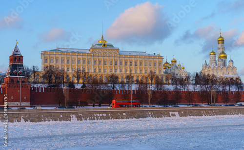 Moscow Kremlin and frozen river on a clear winter day.