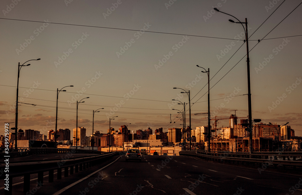 empty road city and buildings sunlight sunset