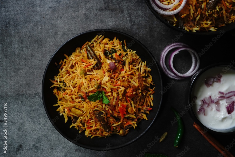 Homemade indian Vegetable / veg biryani with mixed veggies served with raita