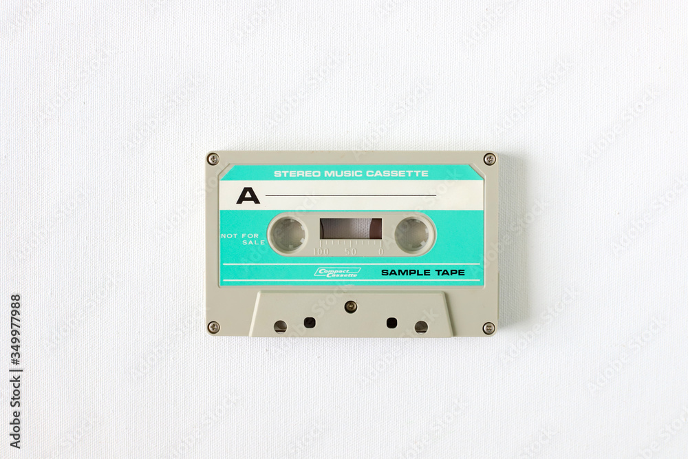 Fototapeta premium Old tape cassette, old or aged wood background. İsolated casette