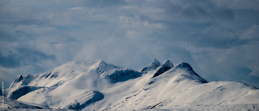 Stortinden in Ballangen area. A mountain on the road to Lofoten in the North of Norway. Landscape picture of a famous tourist area Stortinden in Ballangen area. A mountain on the road to Lofoten in the North of Norway. Landscape picture of a famous tourist area