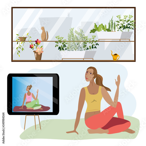 Young woman doing yoga at home. Yoga online.