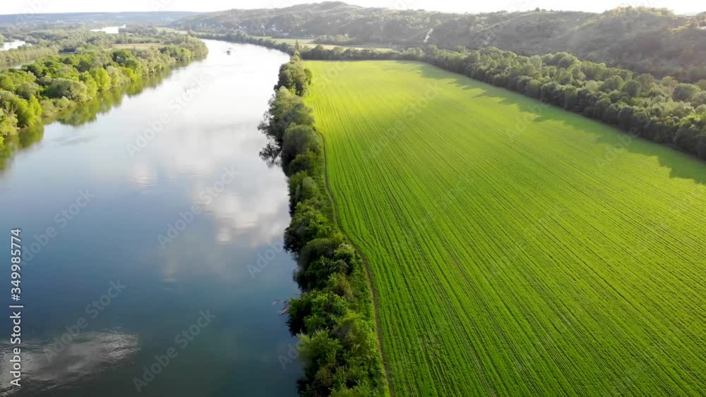 Scenic aerial view of the Seine river and green fields in French countryside. Val d'Oise department, Ile-de-France, Northern France
