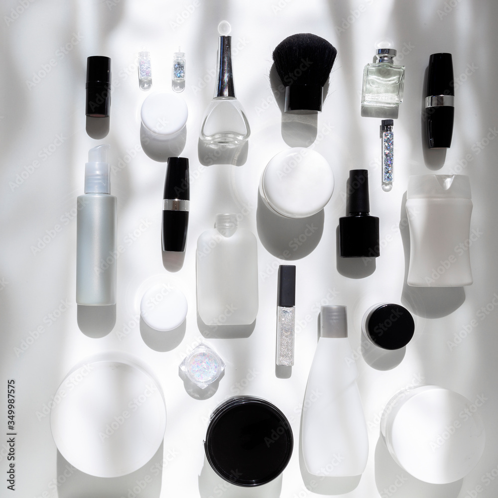 Pattern of black and white cosmetics set with brush, lipstick, perfume, shampoo, cream, lotion. Pattern of black and white cosmetics set with brush, lipstick, perfume, shampoo, cream, lotion.