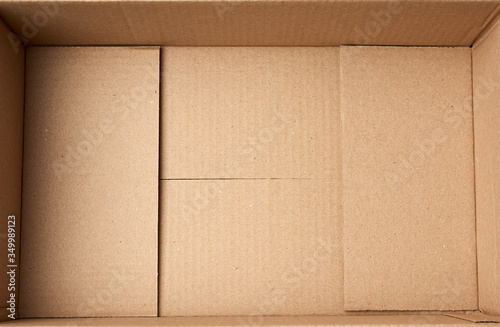 bottom of open empty brown cardboard box, top view © nndanko