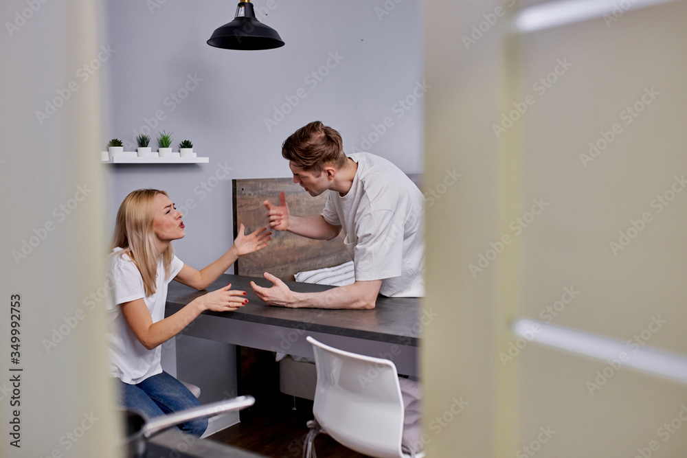 Obraz premium young caucasian married couple have quarrel at home, scream, argue, have family problems. couple going to get divorce
