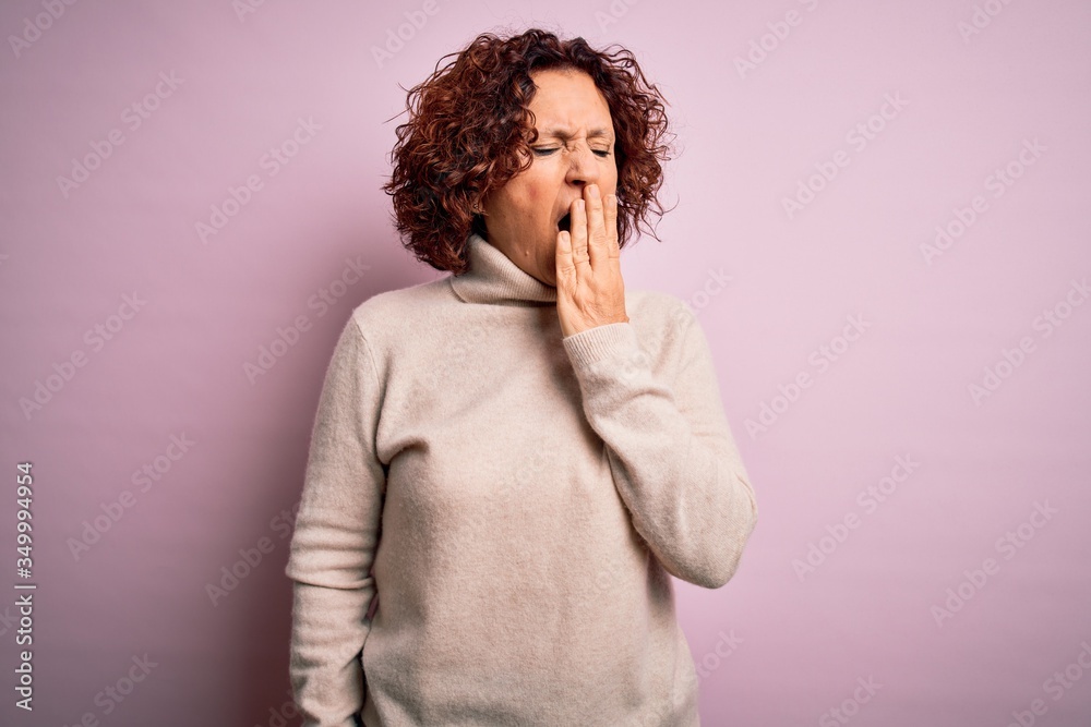 Middle age beautiful curly hair woman wearing casual turtleneck sweater over pink background bored yawning tired covering mouth with hand. Restless and sleepiness. Middle age beautiful curly hair woman wearing casual turtleneck sweater over pink background bored yawning tired covering mouth with hand. Restless and sleepiness.