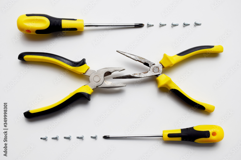 Set of working tools, pliers, wire cutters,, screwdrivers and screws. Building kit. Repair service, building, handyman, carpentry, service center Set of working tools, pliers, wire cutters,, screwdrivers and screws. Building kit. Repair service, building, handyman, carpentry, service center