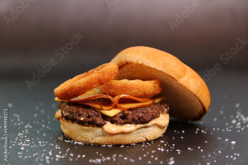 Beef Burger with Meat loafs Salami Pepperoni and Fried Onion Rings Restaurant Menu Image