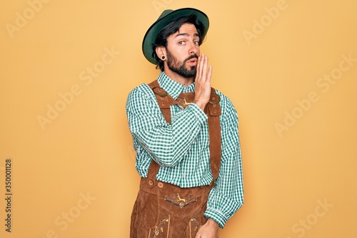 Schilderij op canvas Young handsome man wearing tratidional german octoberfest custome for Germany fe