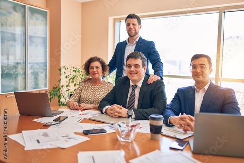 Business lawyers workers meeting at law firm office. Professional executive partners working on finance strategry at the workplace. Smiling happy and cofident to the camera. photo