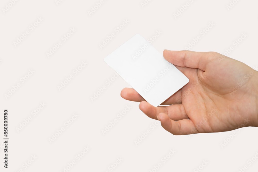 female hand holding bank card with colorful background female hand holding bank card with colorful background