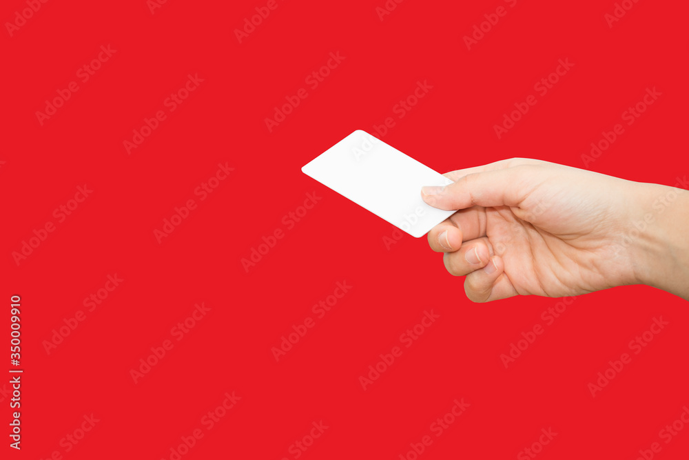female hand holding bank card with colorful background female hand holding bank card with colorful background