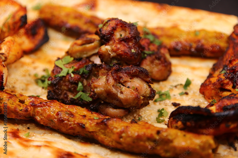 Desi Indian Pakistani BBQ Tikka Platter with Afghani Naan Desi Indian Pakistani BBQ Tikka Platter with Afghani Naan