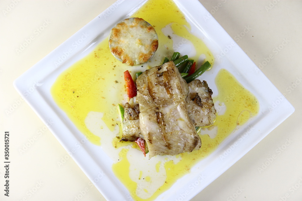 Steamed Fish Steak with Mash Potatoes and Vegies on a ceramic plate Steamed Fish Steak with Mash Potatoes and Vegies on a ceramic plate