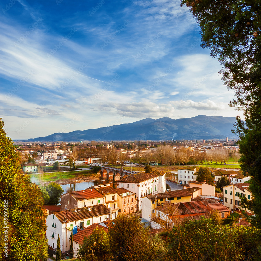 View of Lucca with its famous medieval towers and River Serchio from Monte San Quirico panoramic terrace