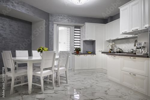 Simple and luxury modern white kitchen interior photo