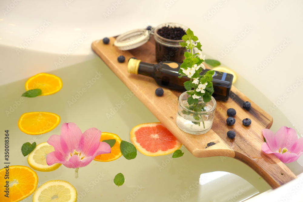Relaxing bath with fresh fruits and mint. Relaxing bath with fresh fruits and mint.