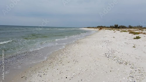 Waves and seashore at the Black Sea on Kinburn Foreland, near Ochakiv, Ukraine photo