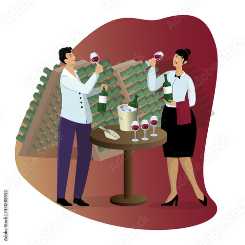 Sommeliers tasting wine from glasses and holds bottles, standing near table against the background of wine cellar with bottles racks